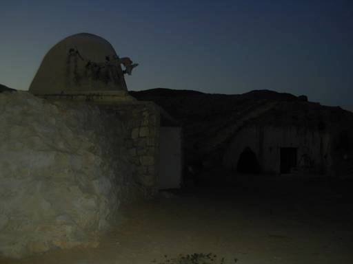 some dwellings cut into the hills ...