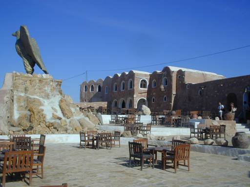 a large eagle statue of a cafe in the hills ...